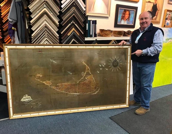 A 4’ X 6 1/2 ‘ painting of Nantucket found in an attic. The 22k gold frame with a white panel has gold stars all around the edge. Frame was built by New Look Frames in Florida