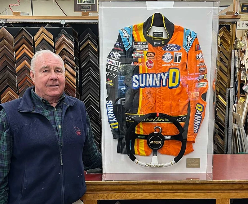 NASCAR driver Kevin Harvick’s fire suit with his steering wheel