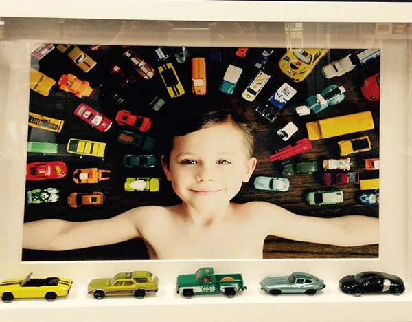 son’s photo along with his favorite cars